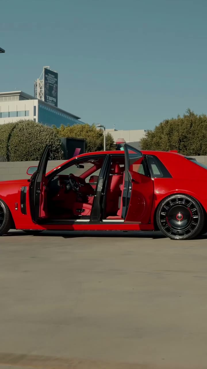 Red Rolls-Royce with red interior, doors open, after its wrap